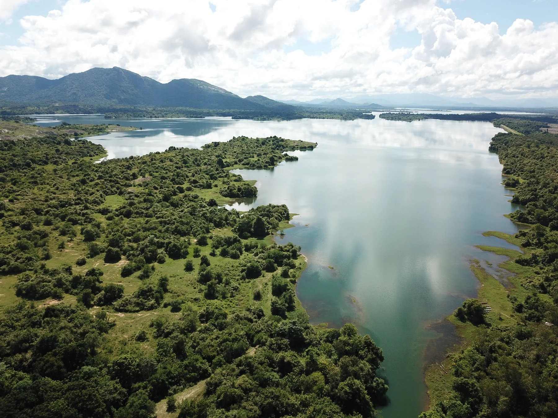 Rathkinda reservoir surrounded by wooded islands and hills in Sri Lanka